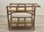 Stunning bamboo and rattan Mid-Century Modern bar cart having two raffia shelves with fitted glass inserts. Cart rolls...