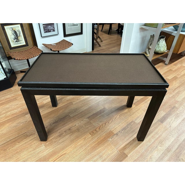 A beautiful faux snakeskin leather game table with a removable top. The top is two sided and the bottom is covered in felt...