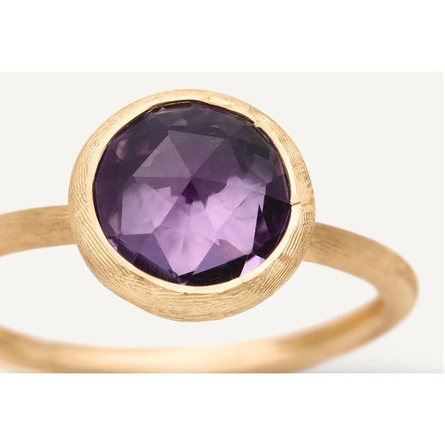 This gorgeous ring by Italian designer Marco Bicego and from their Jaipur Collection, contains a round rose cut amethyst...