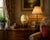 A striking large-scale porcelain decorative egg finished in applied gold leaf and hand-painted with delicate white...