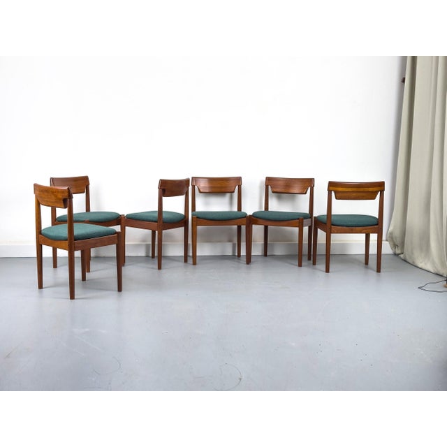Beautiful dining chairs from Denmark, crafted from warm teak wood. The clean lines, tapered legs, and gently curved...