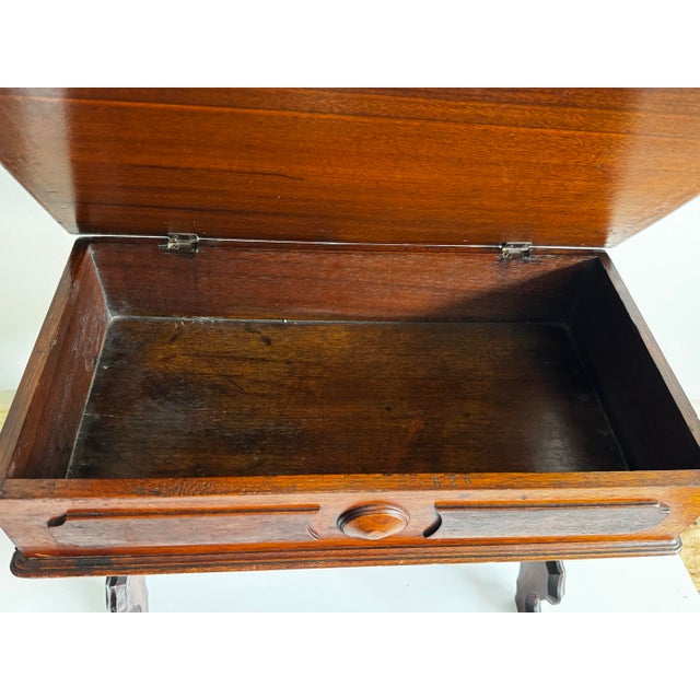 Infuse your space with a captivating piece of history with this exceptional 19th-century Victorian miniature trestle box...