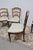 Elegant set of 6 vintage cherry wood dining chairs featuring a graceful scalloped ladder-back design, warm cherry finish,...