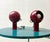 A sculptural pair of magnetic table lamps in the typical space age design of the 1970s. The spherical lamp heads are...