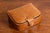 A small antique Camalier & Buckley leather case from the 20th century with buttoned strap. Founded in the 1930s in the...