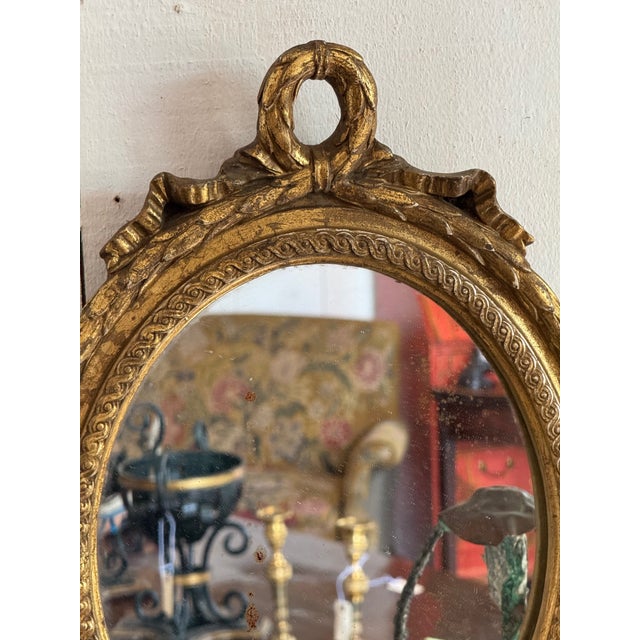 20th Century French Gilt Oval Mirror With Ribbon Crest For Sale - Image 4 of 5