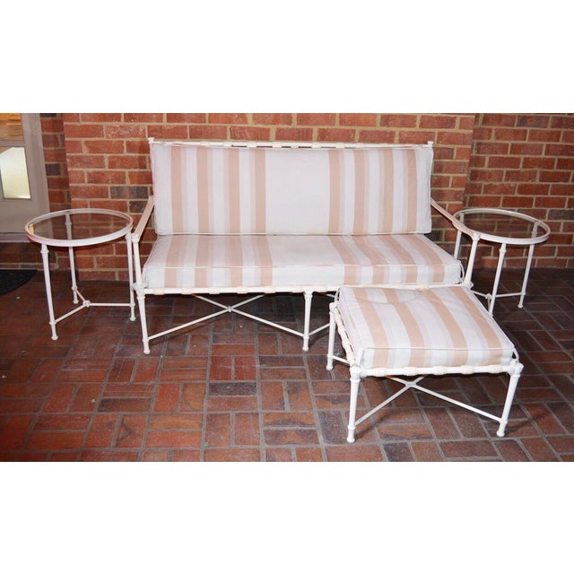 A Vintage Brown Jordan outdoor patio Sofa/Sette, Ottoman and two (2) Accent tables. This vintage set features cream tone...