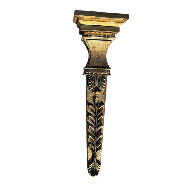 Beautiful gilted wooden wall hanging. Can be a shelf or an obelisk.