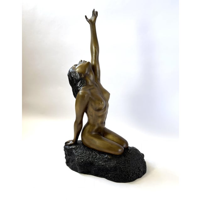 Capture a moment of profound aspiration and grace with this stunning bronze sculpture in the style of Patoue. Standing at...