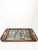 Decorative wooden serving tray dating from the 1970s. The rectangular tray features integrated handles and a richly...