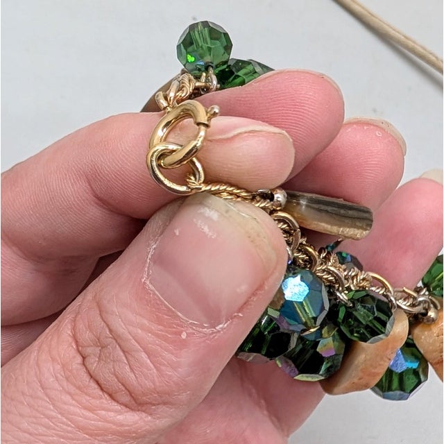 1970s goldtone rectangular pieces of abalone and faceted green resin beads with aurora borealis coating charm bracelet...