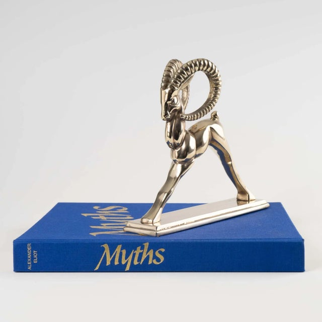 Vintage brass ram figure sculpture. Finely detailed with textured curved horns. Perfect decorative accent piece for...