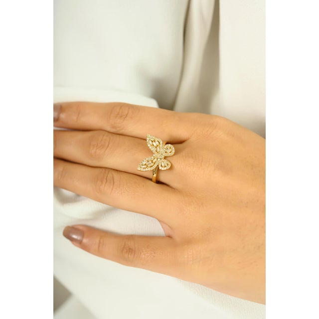 Graceful and radiant, this 18K yellow gold butterfly ring is a true symbol of elegance and transformation. Designed with...
