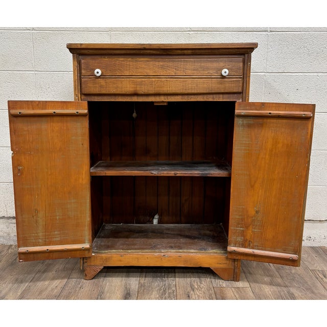 This is a beautiful and rustic, antique, primitive, American jelly cupboard, pie safe, or cabinet, believed to be from the...