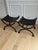 Timeless, sculptural, and impeccably crafted, this exceptional pair of French Empire style curule stools is a striking...