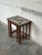 This set of three nesting tables features clean lines and geometric tile tops. Each table nests neatly to save space while...
