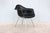 Gorgeous vintage mid-century modern Eames molded fiberglass black armchair. Arguably one of the 20th century's most...