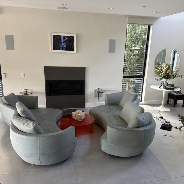 Chic twin set of French blue pebble leather kidney shape sofas. Perfect for a conversation layout. The leather has...