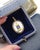 Sentimental French friendship pendant in enamel and 18 karat gold. Pendant centered on a white-ground enameled copper...