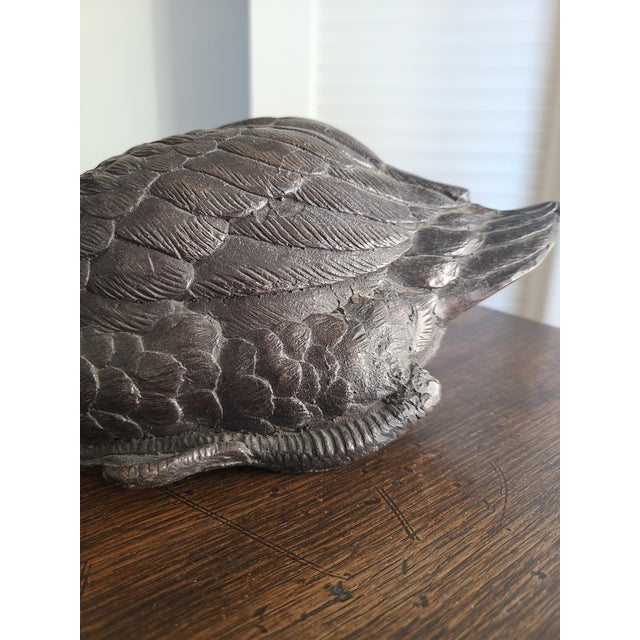 Elegant and finely detailed bronze sculpture of a seated duck. Circa 1920's. Unsigned. Heavy. Works beautifully in a...