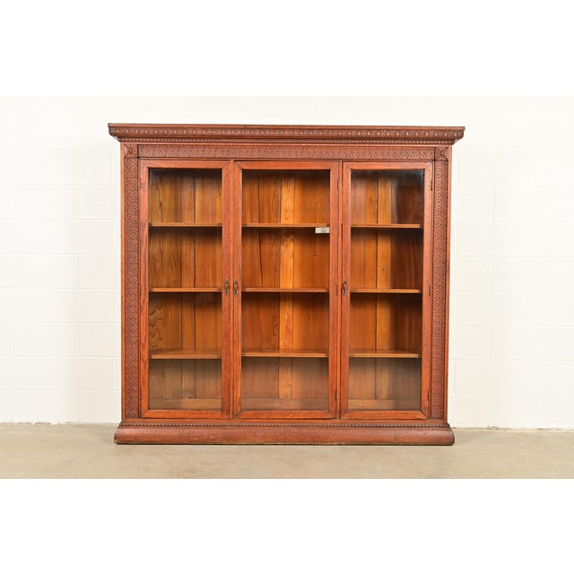 A gorgeous antique Victorian or Renaissance Revival triple bookcase In the manner of R.J. Horner & Co. USA, Circa 1880s...