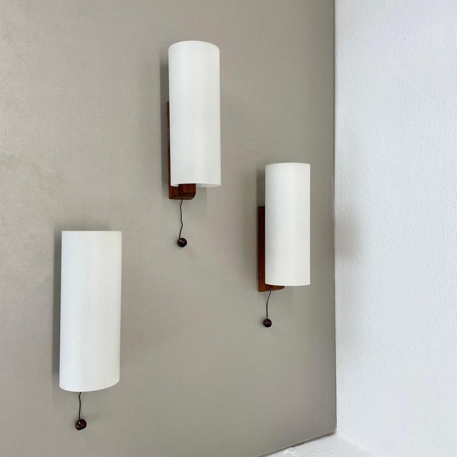 Article: wall light set of 3 Origin: Denmark Age: 1960s This modernist wall light set was produced in DENMARK in the...