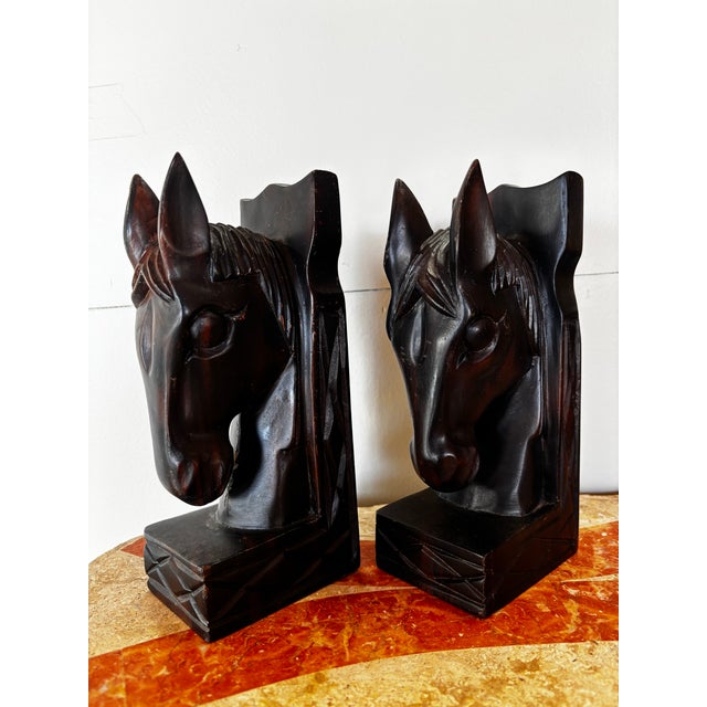 Lovely, stately pair of hand carved wooden horse head bookends.