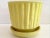 Super cute faux bamboo yellow glazed cachepot. Add some Boho Chic style to your home.