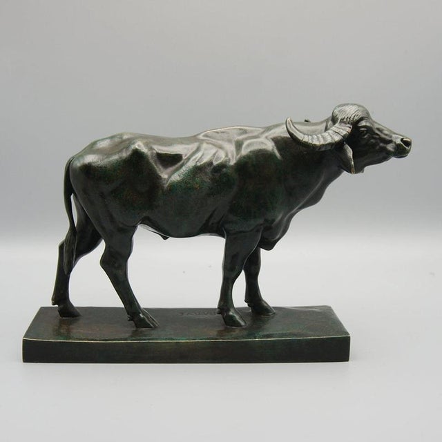 A patinated bronze study of a standing water buffalo by antoine louis barye. Excellent green patina. Signed barye to base....