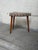Vintage Danish Mid Century Modern corner ottoman stool featuring an unusual triangular form, tapered solid teak legs, and...