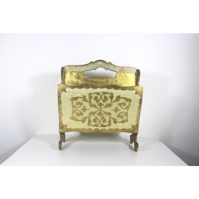 This is a vintage Italian Florentine giltwood magazine rack or holder. This has gorgeous patina with scratches and chips...