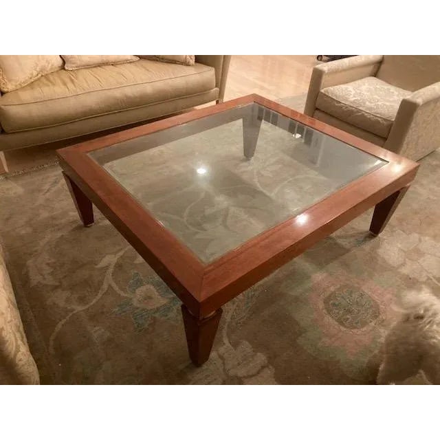 Karl Springer Style Contemporary glass and wood oversized coffee table. Square-ish shape with silver leaf trim on each...