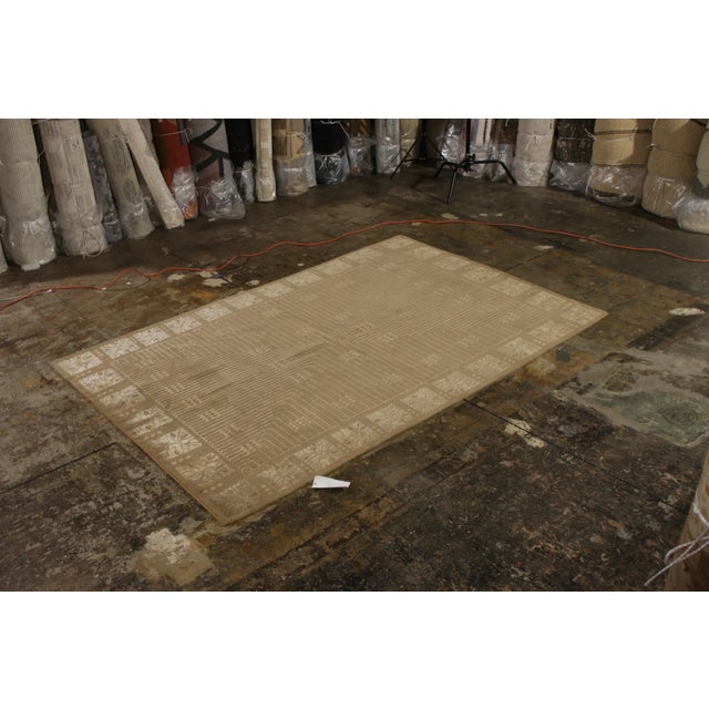 Hand knotted in wool and silk originating from one of our most reputed partner looms in Nepal, this contemporary rug from...