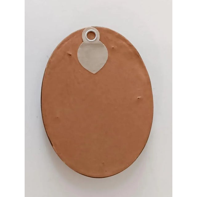 Small late 19th century watercolor on paper portrait painting of young girl. Unsigned. Displayed under glass in oval...