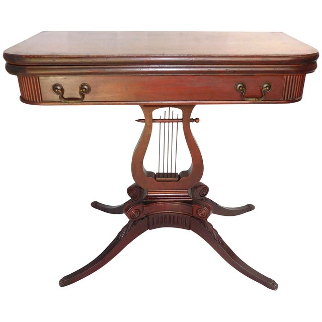 "The Lexington Chair Co. Model 1491 is a highly recognizable Duncan Phyfe-style lyre game table. It features a swivel-flip...