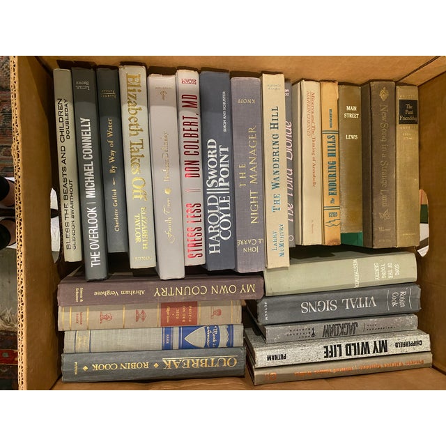 A set of 10 vintage books that range from colors of gray, author, year published that include a variety of literary works....