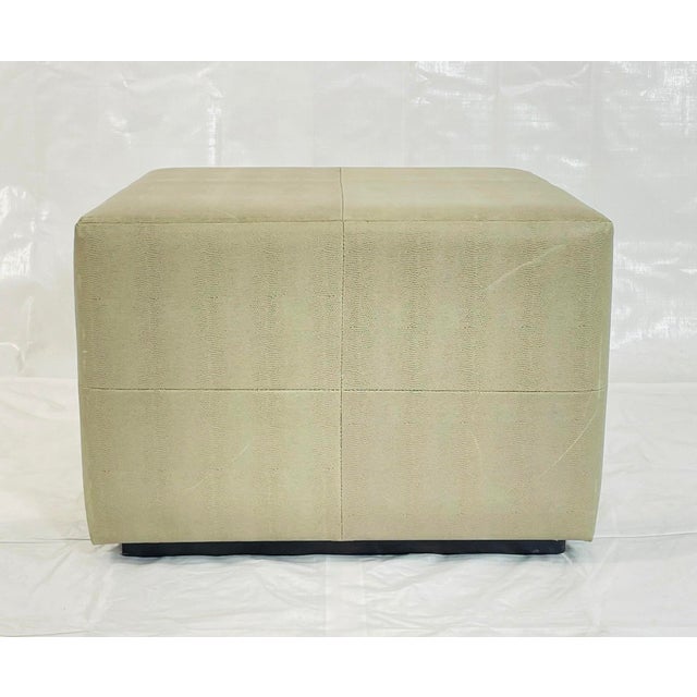 A versatile and sculptural vintage cube ottoman bench upholstered in a textured faux shagreen (vinyl) fabric, resting on a...