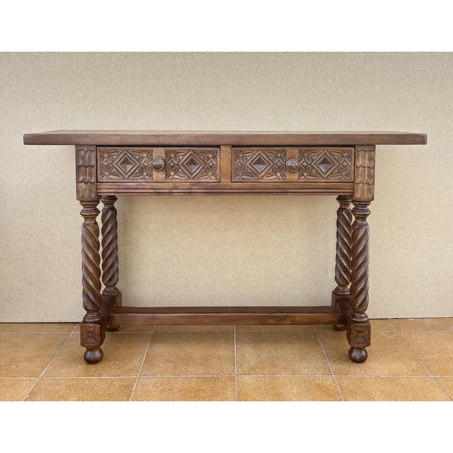 Characterful Spanish console table crafted in hardwood, featuring beautifully carved drawer fronts and elegant barley...