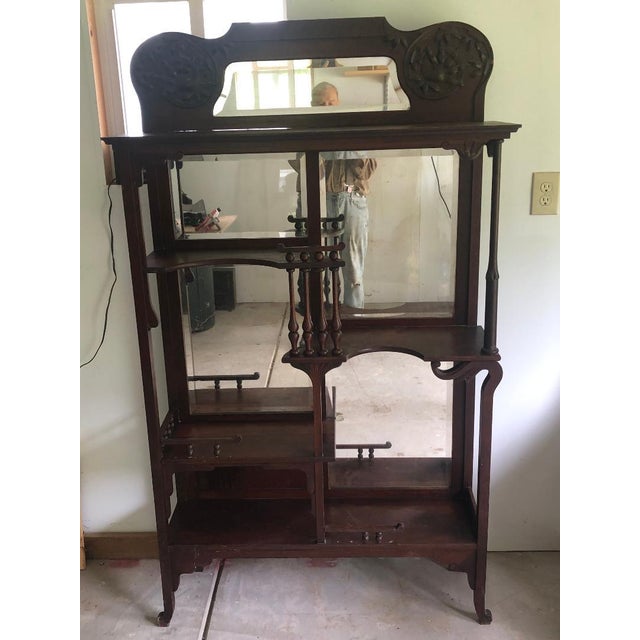 This is an Eastlake style etagere made of either solid mahogany or dark cherry wood for displaying keepsakes, knicknacks,...