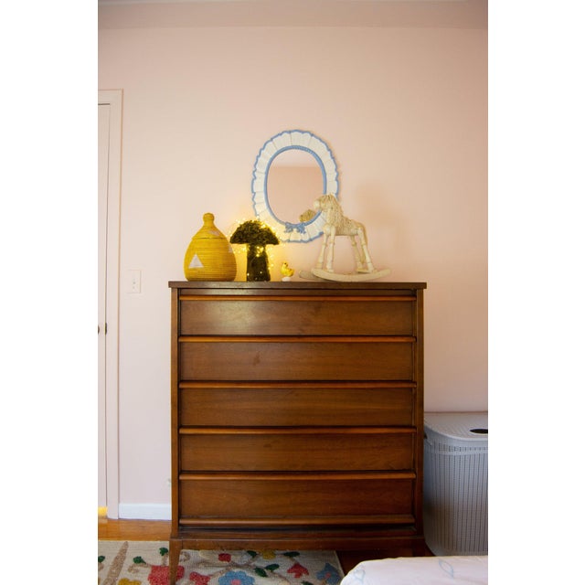 This listing is for a vintage, heavy wall mirror featuring a ruffled rim, oval shape with lacquered cornflower blue and...