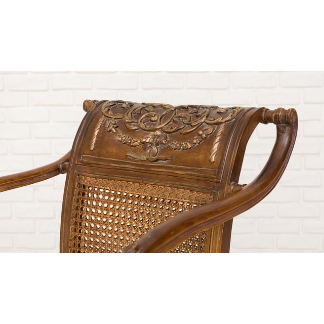 Elegant set of three seating pieces in the Louis XVI style, composed of a settee and a pair of matching armchairs, crafted...