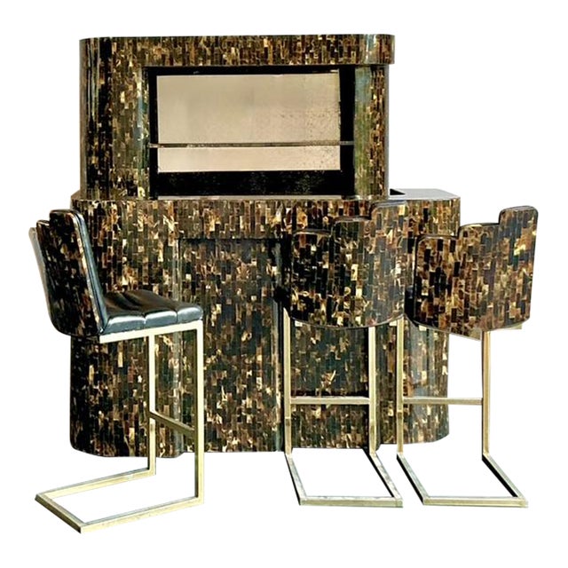 Make a grand statement with this extraordinary vintage dry bar set, comprising a bar unit and four matching stools, all...