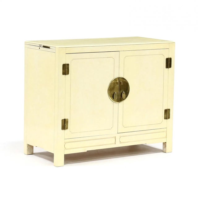 This pair of Asian inspired servers date from the second half of the 20th century and feature marbleized cream painted...