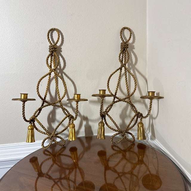 Up for sale is a gorgeous, matching pair of vintage Hollywood Regency style double-arm wall sconces. Crafted from heavy...