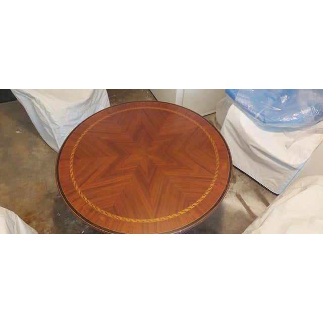 2008 Alfonso Marina Round Table with Star design inlay and trim. 39" W x 34" H. Some minor scuffs on the edge and feet....