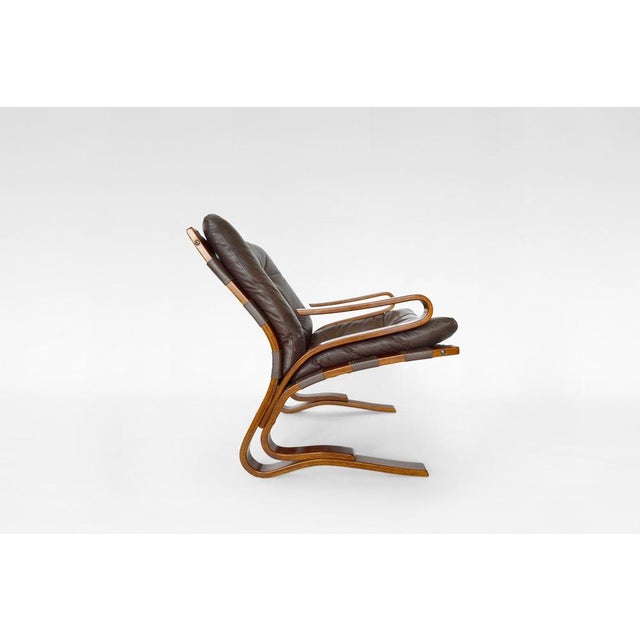 A fantastic condition vintage low-back Kengu armchair. Designed by Elsa&Nordahl Solheim and manufactured by Rybo Rykken &...