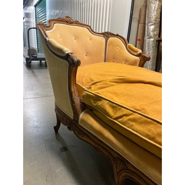 19th century chaise lounge with beautiful detailed carved wood frame.