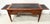 Directoire-style desk in mahogany and oak veneer Four tapered legs with bronze rings Four drawers in the frieze Two side...