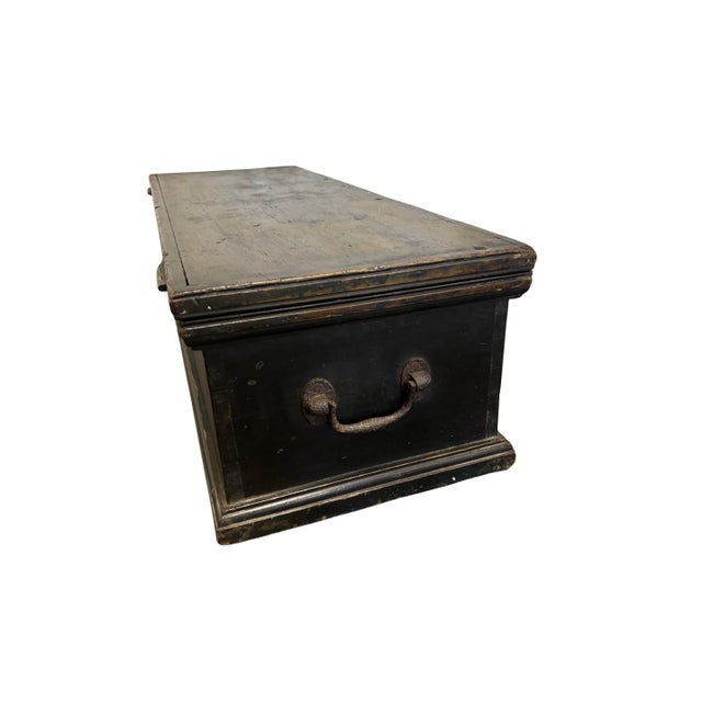 A striking 19th century ebonized English pine box, distinguished by its elegant proportions, refined details, and...