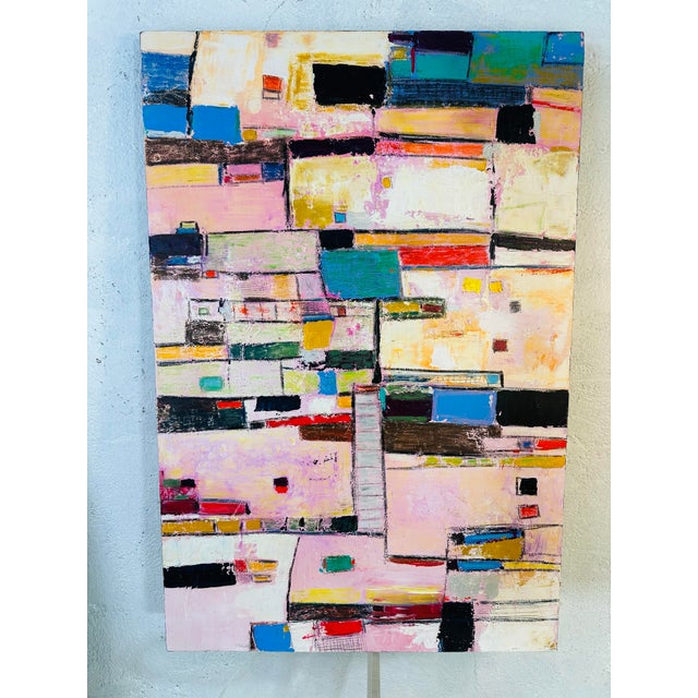 This painting radiates a sense of movement and rhythm through its bold use of color and geometric forms. • The composition...